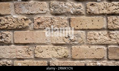 Textured crude stone wall close-up Stock Photo