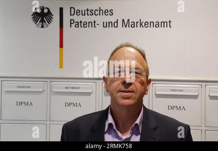 Jena, Germany. 29th Aug, 2023. Markus Ortlieb, Head of the Jena Sub-Office of the German Patent and Trade Mark Office, stands in the entrance area of his office. At a press conference, information was provided on the further expansion of the Jena office. Credit: Bodo Schackow/dpa/Alamy Live News Stock Photo
