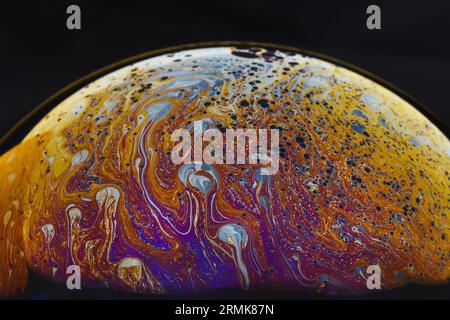Beautiful psychedelic abstractions on the surface soap bubbles Stock Photo