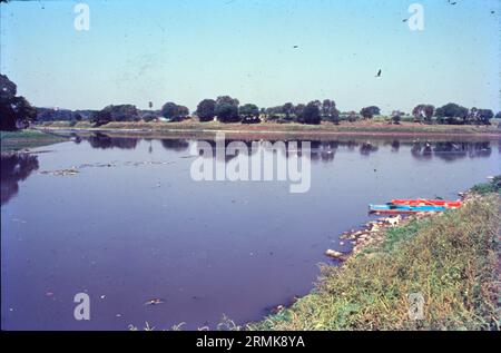 The Mutha River is a river in western Maharashtra, India. It arises in the Western Ghats and flows eastward until it merges with the Mula River in the city of Pune. It has been dammed twice, first at the Panshet Dam, used as a source of drinking water for Pune city and irrigation. Stock Photo