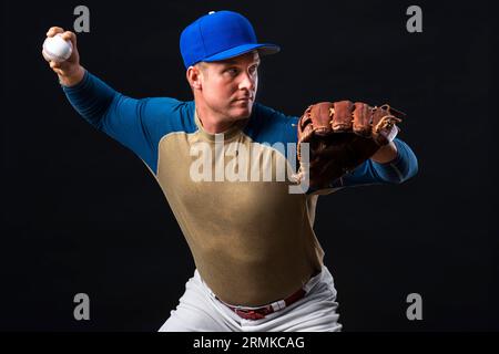 Man posing with baseball glove ball Stock Photo