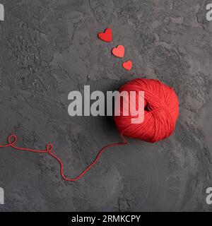 Red wool ball slate background Stock Photo