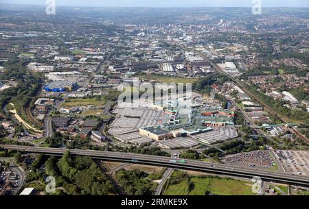 aerial view of the Meadowhall Shopping Centre and Sheffield city, viewed from the east looking west across the M1 Motorway in the foreground Stock Photo
