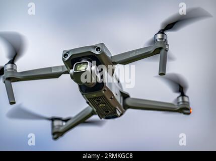 A DJI Air 2S Drone in flight against the sky Stock Photo