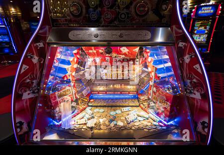 Las Vegas, Nevada, USA, March 10, 2023: Casino gambling blackjack and slot machines waiting for gamblers and tourist to spend money Stock Photo