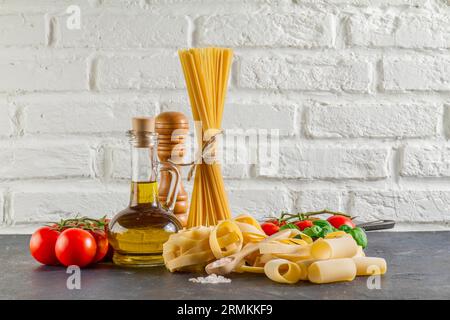 Surface with different types pasta tomatoes oil Stock Photo