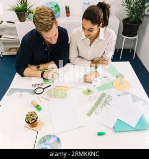 Two businesspeople analyzing graph office Stock Photo