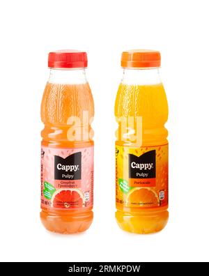 CHISINAU, MOLDOVA - AUGUST 27, 2023. Set Bottles of Cappy Pulpy Grapefruit and Orange fruit juice isolated on white background. Cappy is a brand owned Stock Photo