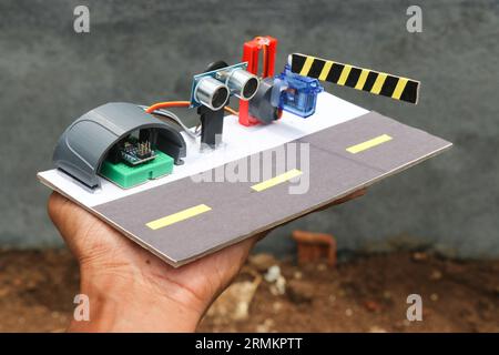 Prototype of automatic toll gate system using ultrasonic sensor sensor and servo with programmable microcontroller Stock Photo