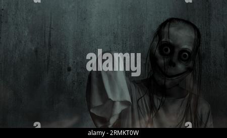 Scary Momo standing behind the wall in the dark background. Scary face for  Halloween. Halloween concept Stock Photo - Alamy