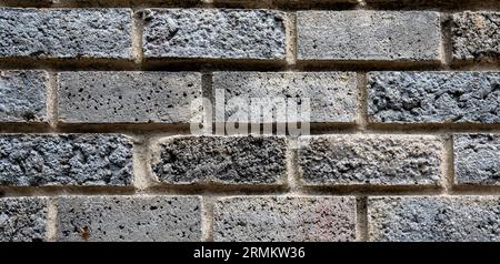Textured crude stone wall close-up Stock Photo
