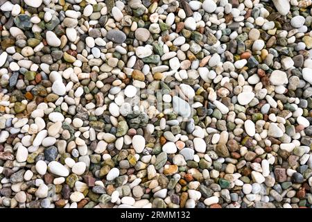 Close-up of the pebble beach. Pebbles as a background. Stock Photo