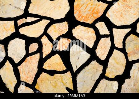 Mediterranean stone wall close-up. Rustic background. Stock Photo
