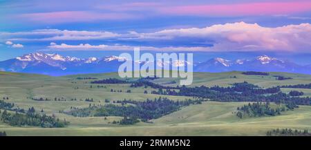 panorama of a sunrise over the flint creek range above meadows in the upper spotted dog creek basin near avon, montana Stock Photo