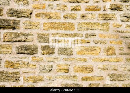 Old rustic stone wall as template for background. Stock Photo