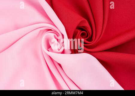 Pink fabric and dark red fabric texture as background. Stock Photo