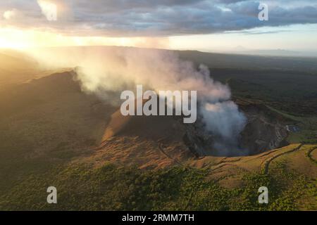 Smoke coming out from Santiago volcano crater aerial drone view Stock Photo