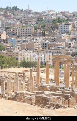 Jerash Jordan the ruins of the ancient Roman city of Gerasa with modern Jerash in the background taken August 2023 Stock Photo
