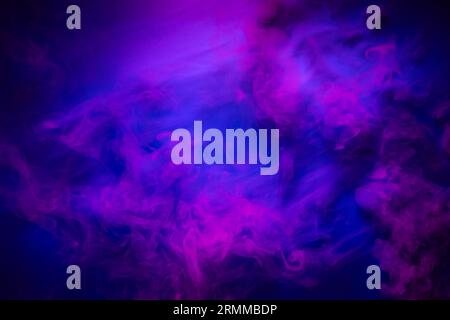 Red smoke on a blue background. Mystic texture in neon colors Stock Photo