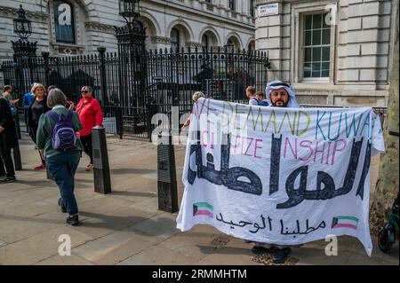 London, UK. 29th Aug, 2023. A small protest demanding Kuwaiti Citizenship in Whitehall outside Downing Street - in advance of the meeting between The Crown Prince of Kuwait Sheikh Meshal Al-Ahmad Al-Jaber Al-Saba and Prime Minister Rishi Sunak. The visit to Number 10 partially disrupted by opponents of the ultra-low emission zone (Ulez) outside. Credit: Guy Bell/Alamy Live News Stock Photo