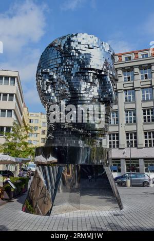 The Head of Franz Kafka (Czech: Hlava Franze Kafky), also known as the Statue of Kafka, is an outdoor sculpture by David Černý depicting Bohemian Germ Stock Photo