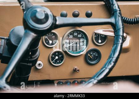 Time-Tested Interior: The antique dashboard of a military car showcases retro design, taking us back to an era of classic automobiles. Stock Photo