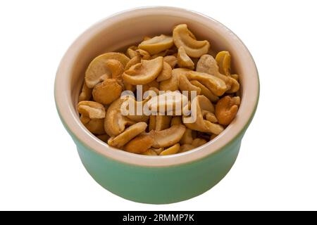 Bowl of Roasted & Salted Cashews nuts isolated on white background Stock Photo