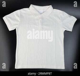 White polo shirt front view isolated on black studio background Stock Photo