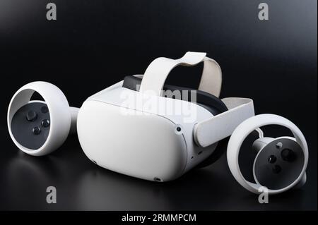 Vr kit wireless headset with joystick isolated on black studio background Stock Photo