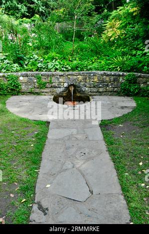 Chalice Well Gardens, Glasonbury, Somerset, England - Lions Head Fountain Stock Photo