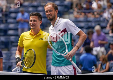 Daniil Medvedev of Russia, right, poses after winning the final