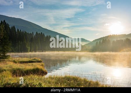 Tamsweg: morning mist on lake Prebersee in Lungau, Salzburg, Austria Stock Photo