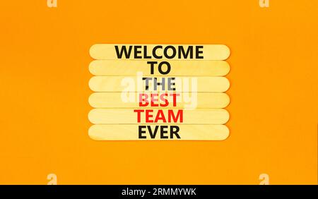 Welcome to best team symbol. Concept words Welcome to the best team ever on wooden stick on beautiful orange background. Business, motivational and we Stock Photo