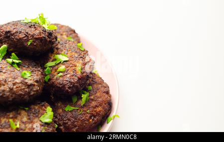 Fried minced cutlets served in a pile on a plate, typical eastern european homemade food, tasty dish Stock Photo
