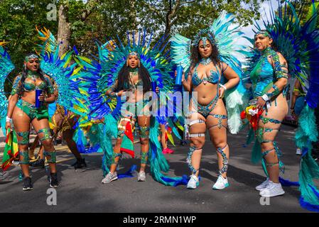 Female participants at the Notting Hill Carnival Grand Parade 2023, London, UK. Girls in elaborate feather costumes Stock Photo