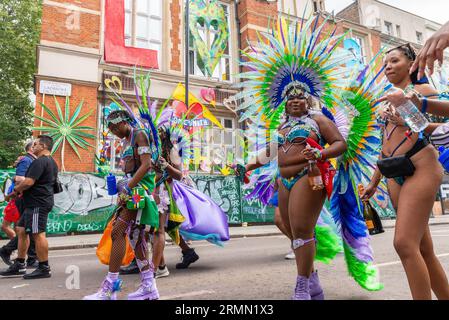 Female participants arriving in Ladbroke Grove at the Notting Hill Carnival Grand Parade 2023, London, UK. Wearing elaborate costumes Stock Photo