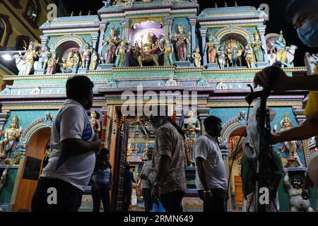 Worshippers at night at the Sri Vadapathira Kaliamman Temple near Little India in Singapore. 13/10/2022 Stock Photo