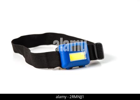 Head Torch flashlight on white background isolation. Light battery operated lamp worn on head. Stock Photo