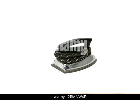 small old electric iron isolated on white background. Vintage small metal retro iron with cable Stock Photo