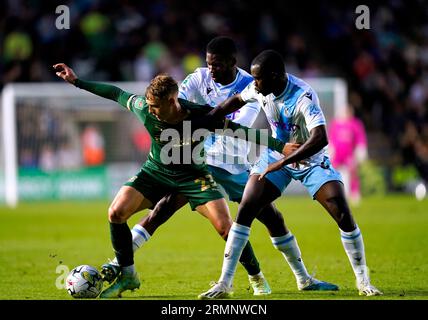 Plymouth Argyle's Ben Waine (left) battles for the ball with Crystal Palace's Tyrick Mitchell (right) and Jefferson Lerma during the Carabao Cup second round match at Home Park, Plymouth. Picture date: Tuesday August 29, 2023. Stock Photo