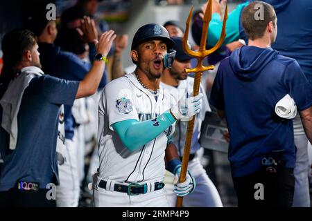 Seattle Mariners' Julio Rodriguez holds a trident in the dugout after  hitting a home run against the Oakland Athletics in a baseball game Monday,  Aug. 28, 2023, in Seattle. (AP Photo/Lindsey Wasson Stock Photo - Alamy