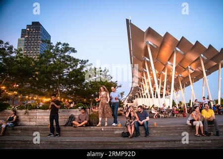 Long Island City, New York - July 13, 2019:  View at sunset from Gantry Plaza State Park in Queens New York City. Stock Photo