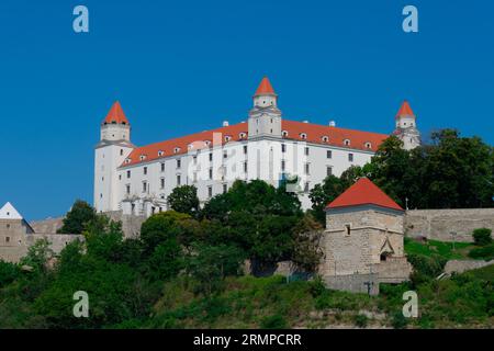 Bratislava, Slovakia. August 15, 2023. Bratislava Castle, rectangular building with four corner towers  on an rocky hill of the Little Carpathians abo Stock Photo