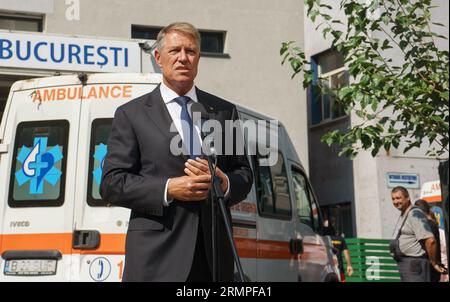 Bucharest, Romania. 28th August, 2023: Klaus Iohannis, the president of Romania, speaks to the press at Bucharest Clinical Emergency Hospital - SCUB Floreasca after visiting the firefighters injured in the fire at an unauthorized LPG station in Crevedia commune, 28 km northeast of Bucharest, where several tankers were located, two of which exploded, killing two people and injuring 58 others, mostly firefighters. Credit: Lucian Alecu/Alamy Live News Stock Photo