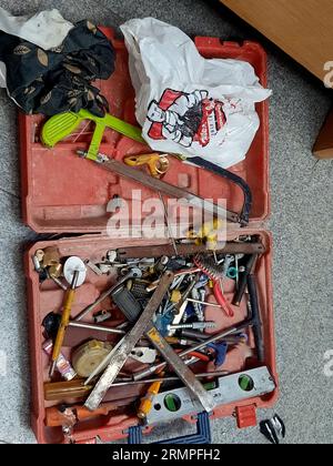 Cairo, Egypt, August 24 2023: Portable toolbox with various set of useful tools for maintenance and fixing things, with screwdrivers, saw, wrenches, b Stock Photo