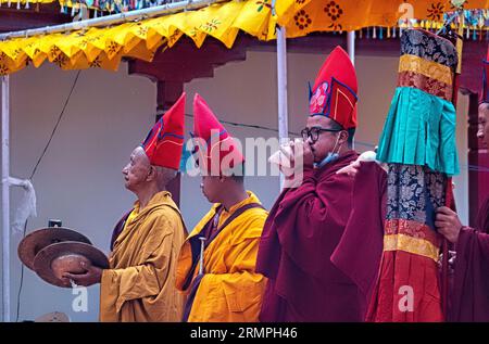 Monk playing a dung dkar conch shell trumpet at the Takthok Tsechu festival, Sakti, Ladakh, India Stock Photo