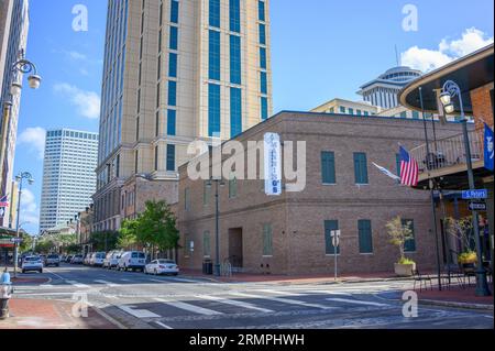 NEW ORLEANS, LA, USA - AUGUST 22, 2023: Manning's Restaurant and Sports Bar and surrounding buildings in the Warehouse District Stock Photo
