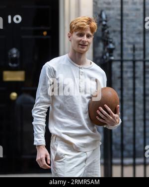 London, England, UK. 29th Aug, 2023. JAKE BARRACLOUGH poses with a rugby ball outside 10 Downing Street, London, as he marks the 200th anniversary of the creation of the game of rugby by running the 450km from Rugby School to Paris, ahead of the Rugby World Cup in France. (Credit Image: © Tayfun Salci/ZUMA Press Wire) EDITORIAL USAGE ONLY! Not for Commercial USAGE! Stock Photo