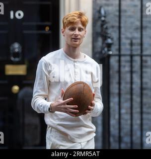 London, England, UK. 29th Aug, 2023. JAKE BARRACLOUGH poses with a rugby ball outside 10 Downing Street, London, as he marks the 200th anniversary of the creation of the game of rugby by running the 450km from Rugby School to Paris, ahead of the Rugby World Cup in France. (Credit Image: © Tayfun Salci/ZUMA Press Wire) EDITORIAL USAGE ONLY! Not for Commercial USAGE! Stock Photo