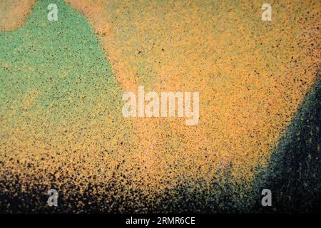 Green and orange and black colored wall. Colorful background Stock Photo